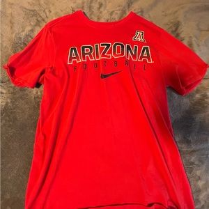 U OF A football shirt.